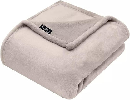 Nicole Miller Oversized Plush Fleece Throw Blanket – Ultra Soft, Lightweight & Cozy – 60" x 70" Warm Flannel Blanket for Couch, Bed & Travel – Machine Washable (Pumice-Tan)