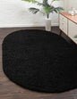 Unique Loom Solid Shag Collection Area Rug (5' 1" x 8' Oval, Jet Black)